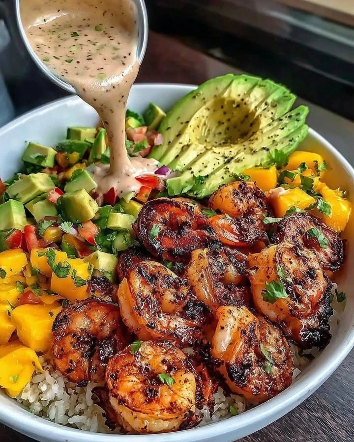 Recipe Title: Shrimp and Avocado Bowls with Mango Salsa & Lime-Chili Sauce finished