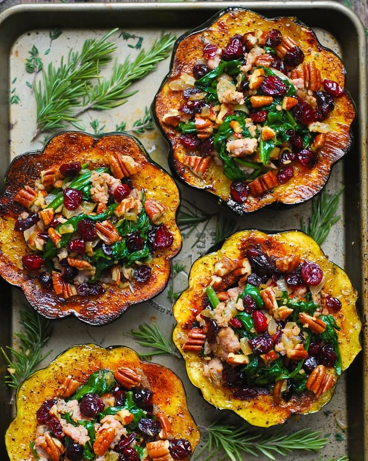 Stuffed Acorn Squash with Sausage, Spinach, Pecans, and Dried Cranberries finished