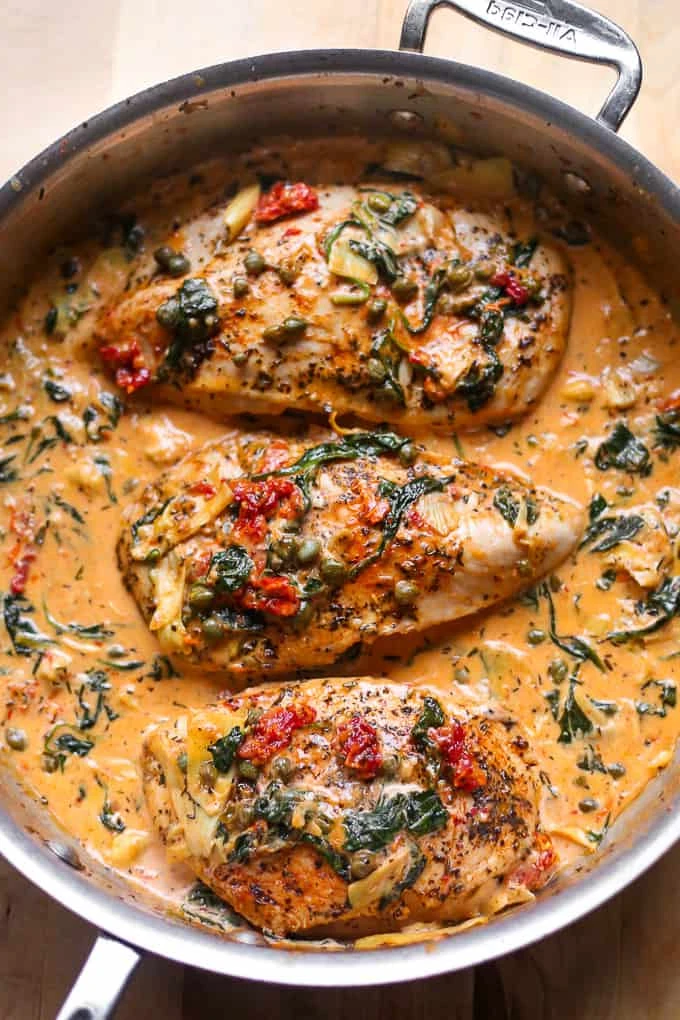 Creamy Tuscan Chicken with spinach, artichokes, sun-dried tomatoes, capers, and creamy garlic sauce. LOW-CARB, HIGH-PROTEIN, GLUTEN-FREE. finished
