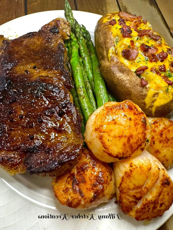 NY strip, scallops, loaded baked potato & asparagus finished